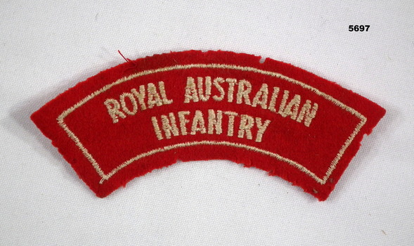 Red cloth shoulder badge.