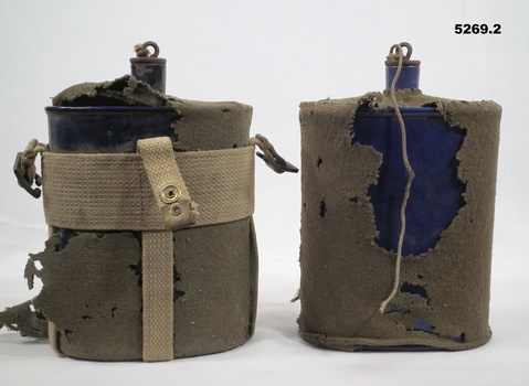 Two Australian Army issued Water bottles in khaki cotton fabric casing.