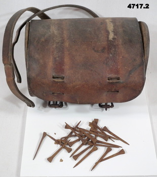 Light Horsemen leather bag containing nails (rusted)