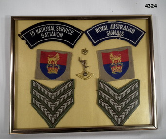 Framed rank stripes and shoulder patches.
