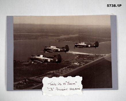 Black and white photograph of RAAF Wirraway aircraft flying in formation.