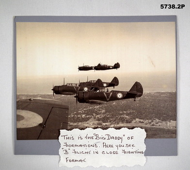Black and white photograph of RAAF Wirraway aircraft flying in formation.