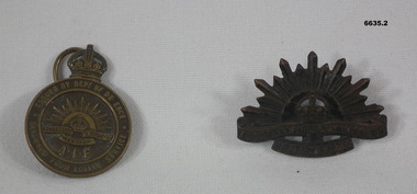 Two metal Badges Rising Sun and Returned from Active Service.