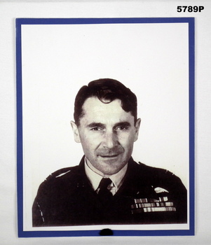 Black and white head and shoulders photograph of Ian Lyons in RAAF uniform.