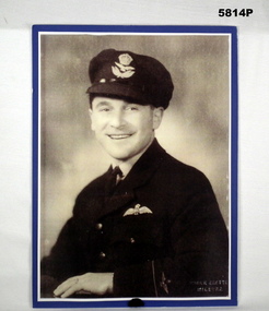 Black and white potrait photograph of Ian Lyons in RAAF uniform.