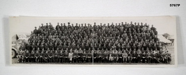 Panorama B & W photo showing a large group of Airmen.