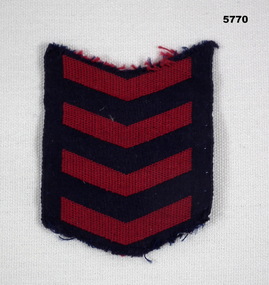 Four red chevron stripes for overseas service.