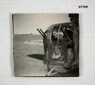 Photograph showing an Airmen in a Gun turret.