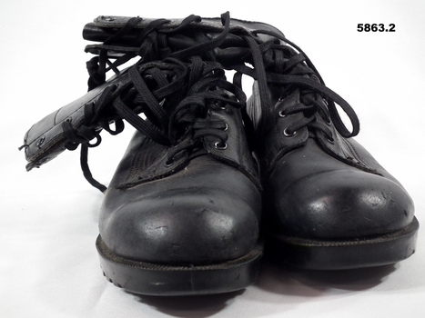 One pair Black GP leather boots.