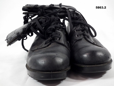 One pair Black GP leather boots.