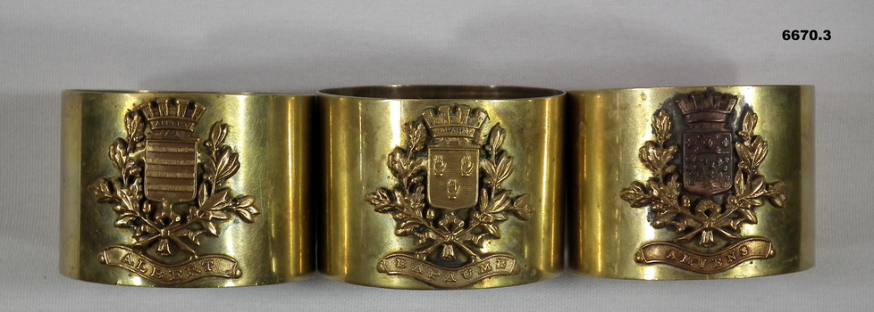 Three Souvenir Gold Napkin Rings.