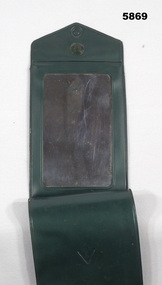 Shaving mirror in a Nylon case.