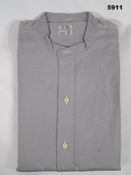 Grey collarless RAAF uniform shirt with half closure two button front.