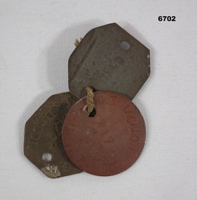 Set of identity discs with rope cord.