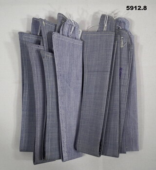 Eight detachable starched blue/grey RAAF shirt collars.