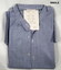Collarless light blue RAAF shirt with long sleeves.