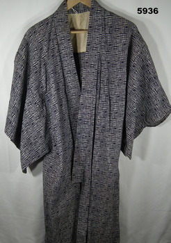 Traditional Japanese robe in black and white patterned fabric.