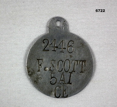 Single metal identity disc.
