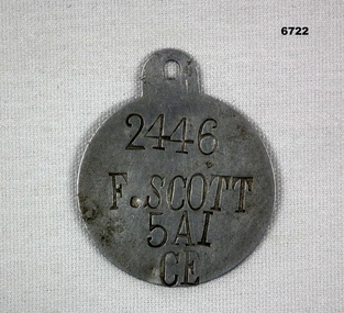 Single metal identity disc.