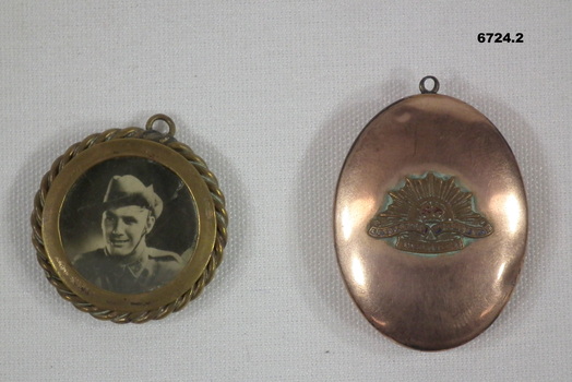 Two metal ornamental lockets.