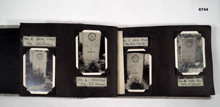Inside of photo album showing photos of graves.  38 Btn WW1.