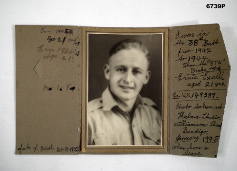 Sepia photograph on cardboard backing - head and shoulders pose.