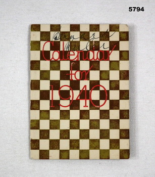 Small folded calendar with pages for months etc inside 1940