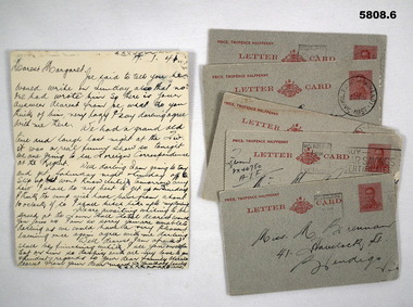 Letter cards handwritten home from camp.