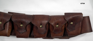 Brown leather Bandolier for ammunition.