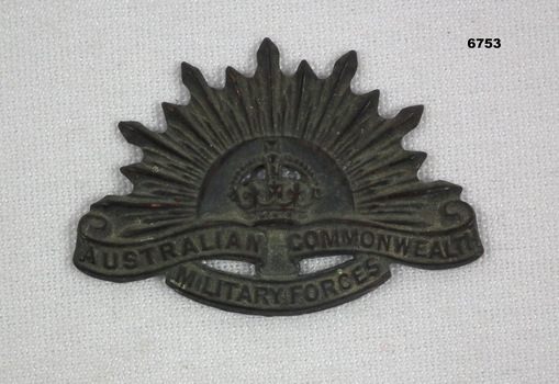 Black metal Rising Sun Badge.