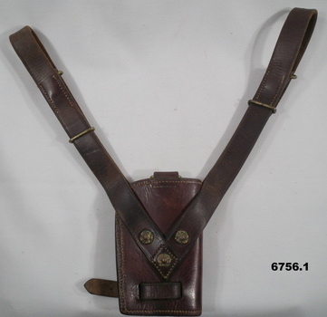 Ceremonial brown leather scabbards with metal studs.