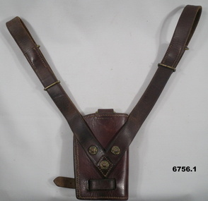 Ceremonial brown leather scabbards with metal studs.