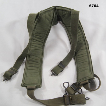 Khaki coloured webbing shoulder harness.