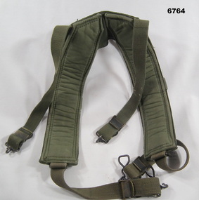 Khaki coloured webbing shoulder harness.
