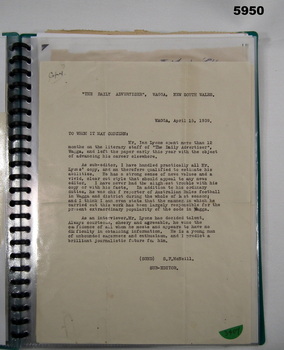 Display book containing letters and photographs.