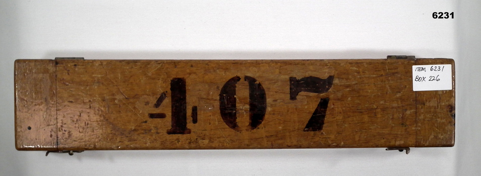 The wooden box containing a Ruler Parallel Rolling 15"