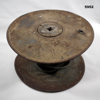 1918 metal and wood cable drum for telephone lines.