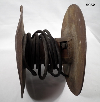 1918 metal and wood cable drum for telephone lines.