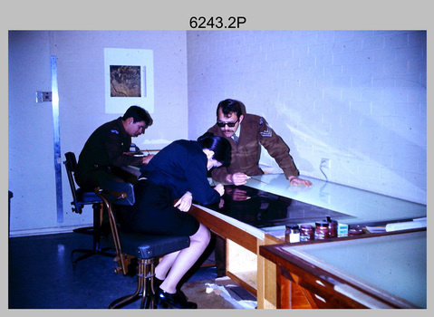 Technicians retouching Orthophotomap reproduction material at the Army Survey Regiment. c1975.