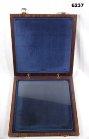A wooden box containing a glass plate used for adjusting Aerial Photography
