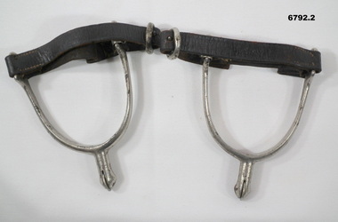 Set of horse spurs with leathers strap.