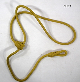 Yellow cord shoulder lanyard with loop.