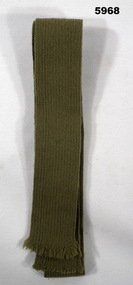 Military issue woven khaki coloured tie with cut ends.