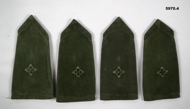 Two pairs of jungle green coloured slide shoulder boards with one pip.