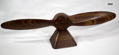 Laminated model wooden propeller on mount.