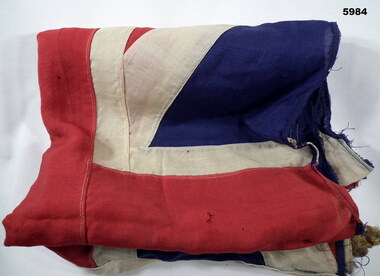 Old cotton British Flag with rope.