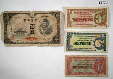 Old Asian note and British Armed Forces notes.