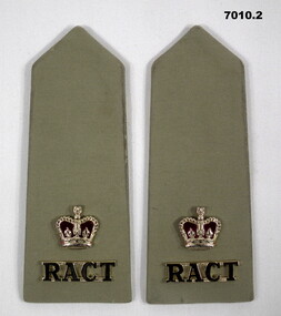 Pair of khaki coloured shoulder boards, each with a Queen's Crown and Corps badge.