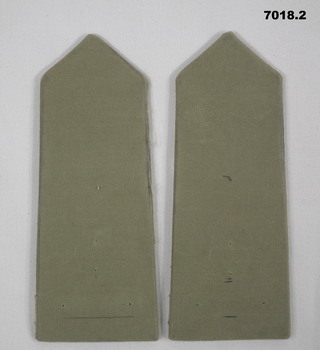 Pair khaki coloured shoulder boards without rank insignia or corps badge.