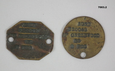 Two metal, soldier's dog tags.
